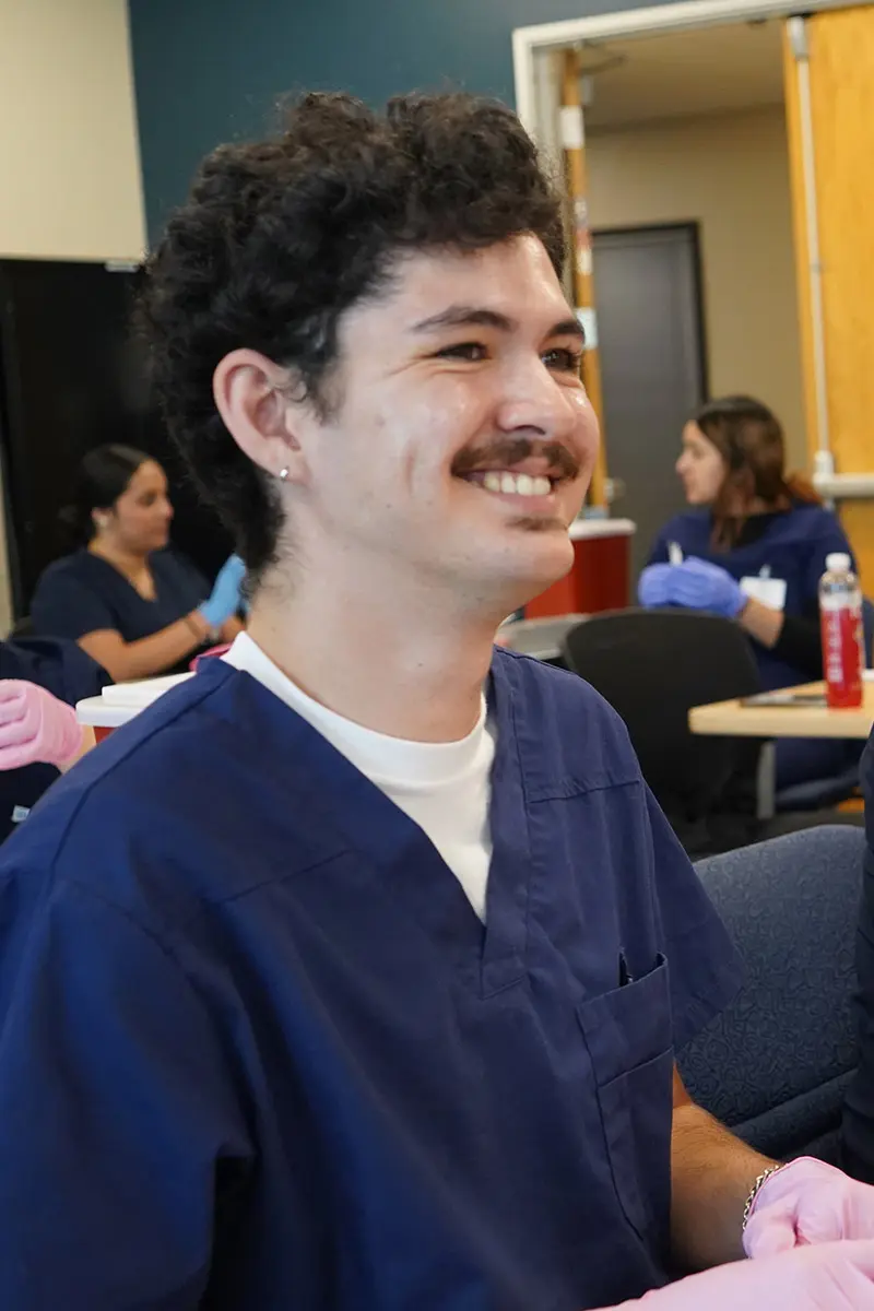 Smiling medical student with mustache