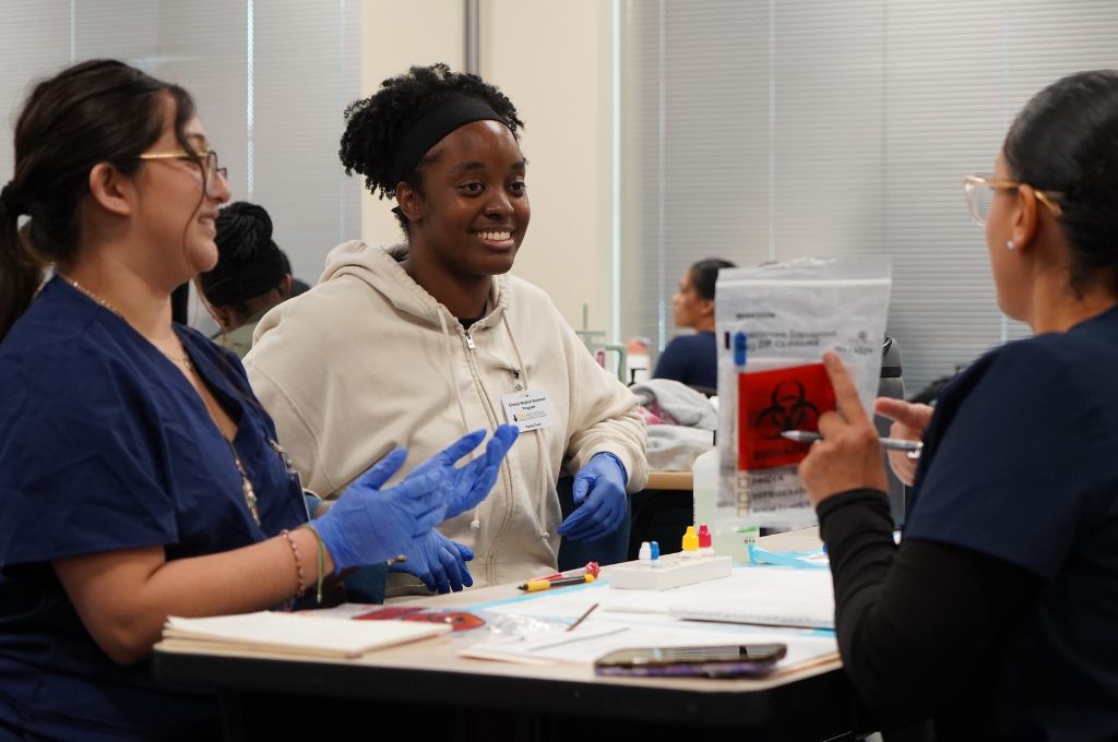 Medical assistant students practicing clinical skills during hands on training in Antioch, California
